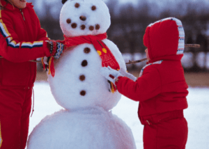 Children building snowman